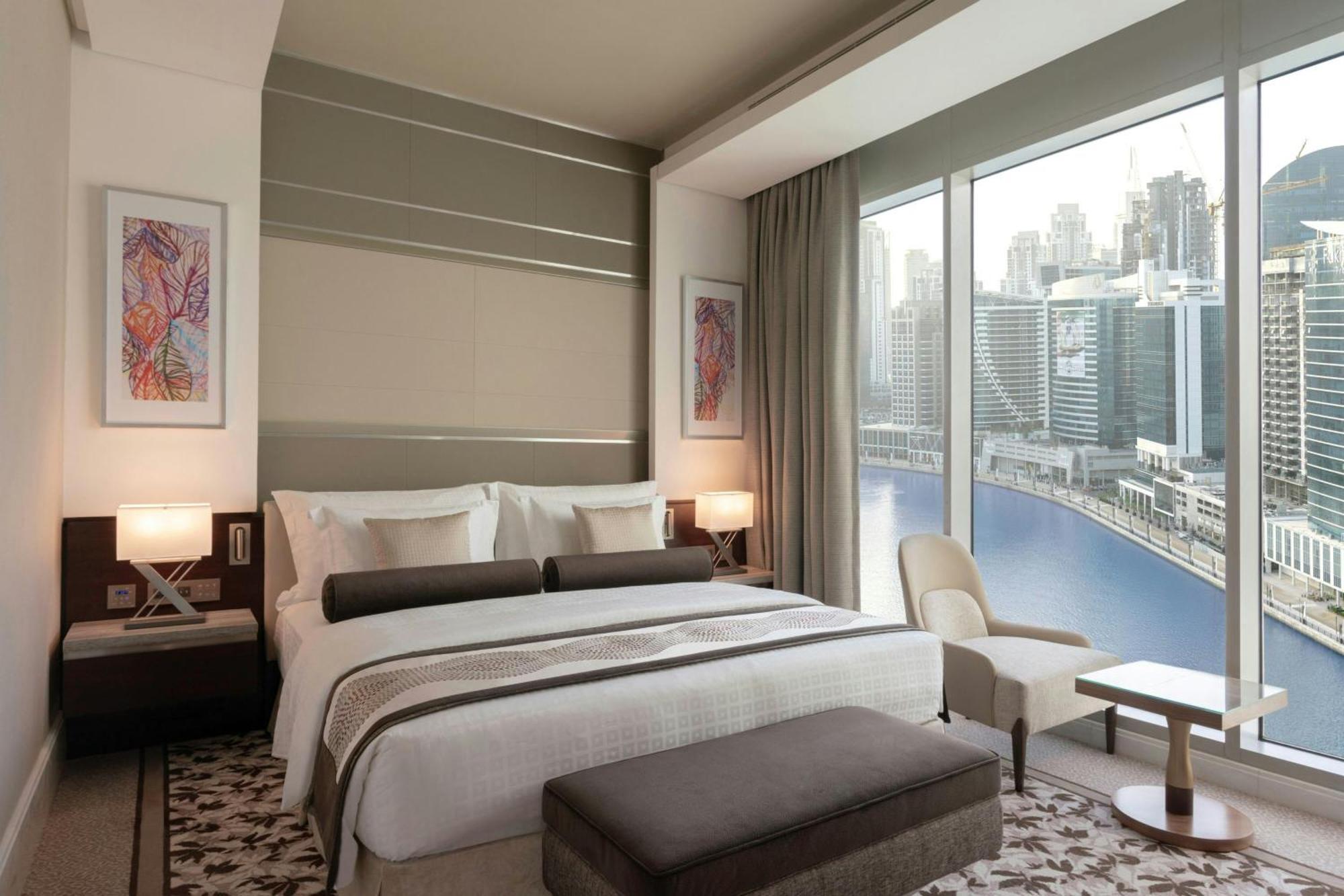 One-Bedroom King Suite Canal Bay View Lounge Access complimentary Daily Snacks Evening Cocktail Hour & Canapes Complimentary Shuttle to Dubai Mall Bay Metro Station & Kite Beach,1643201029:JPEG
